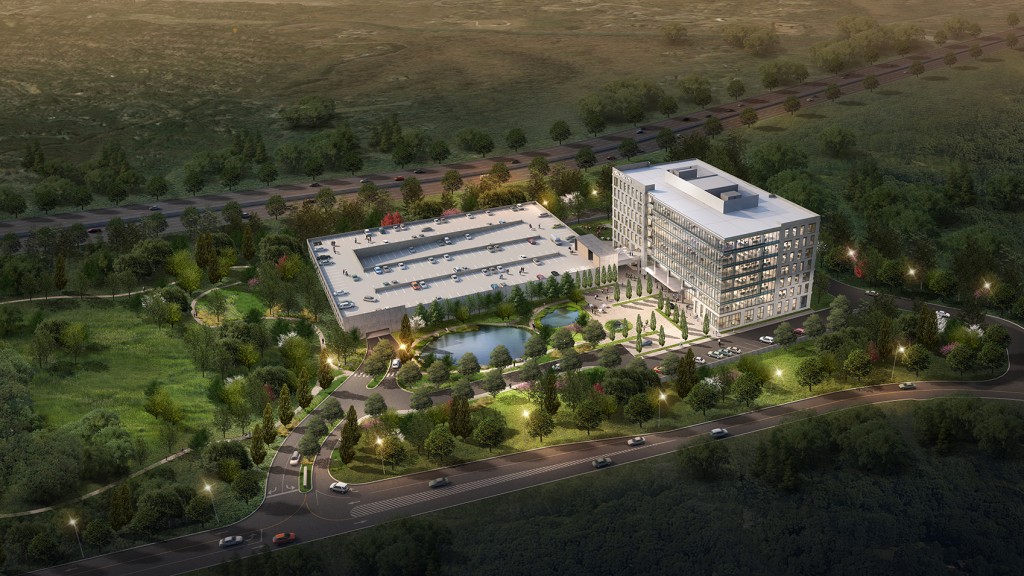 A large building with a parking lot.